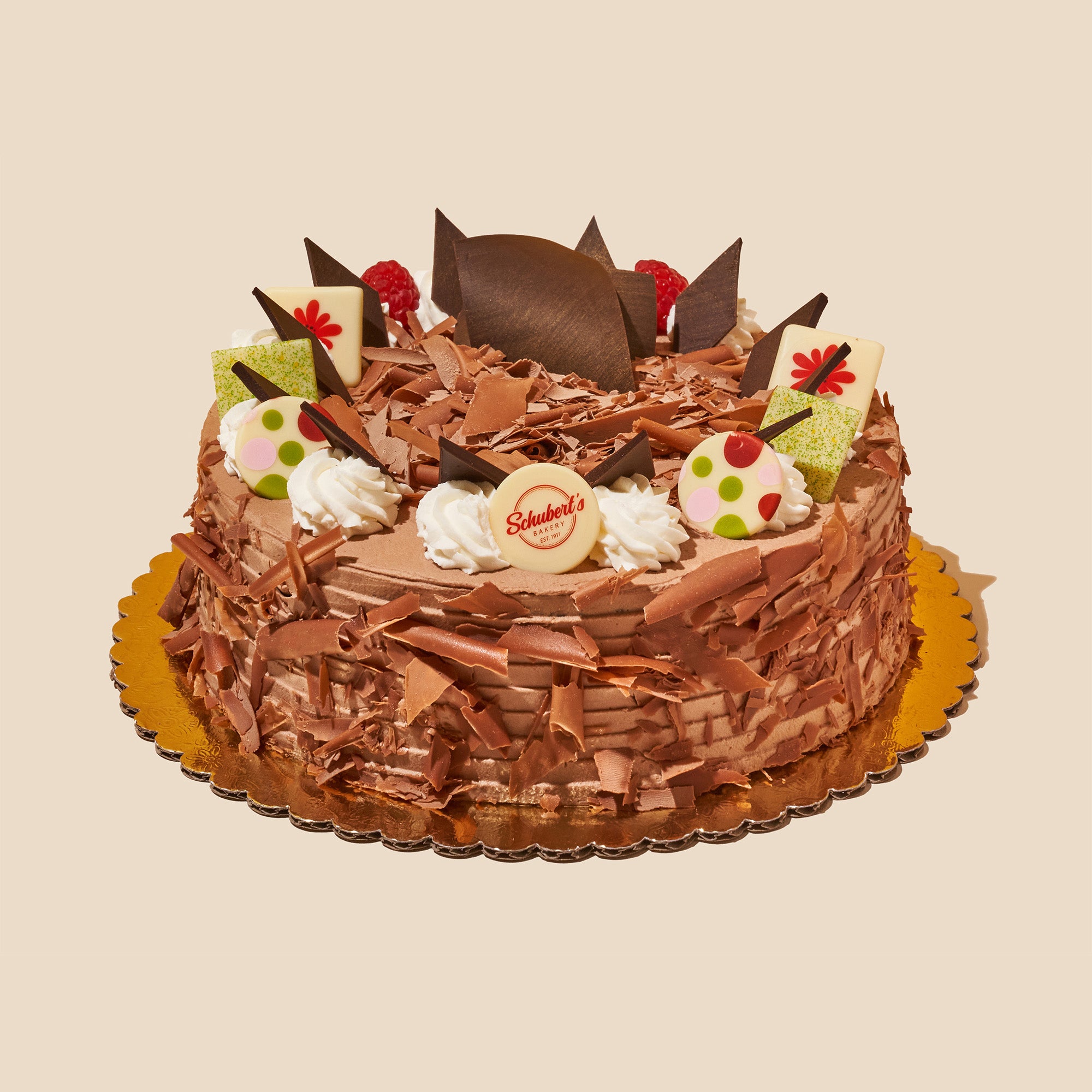 chocolate mousse cake with whipped cream and chocolate shavings
